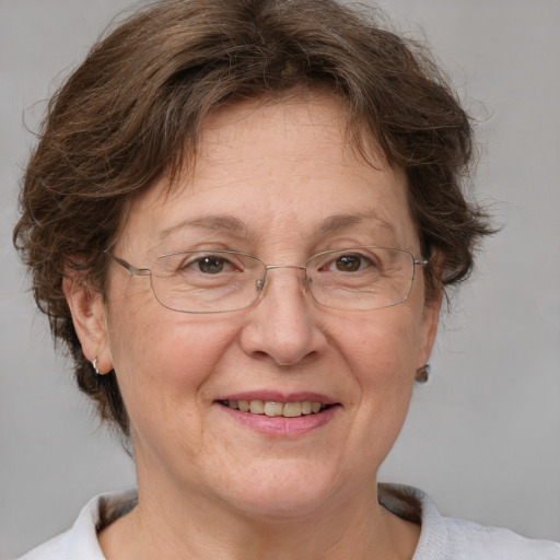 Joyful white middle-aged female with short  brown hair and brown eyes