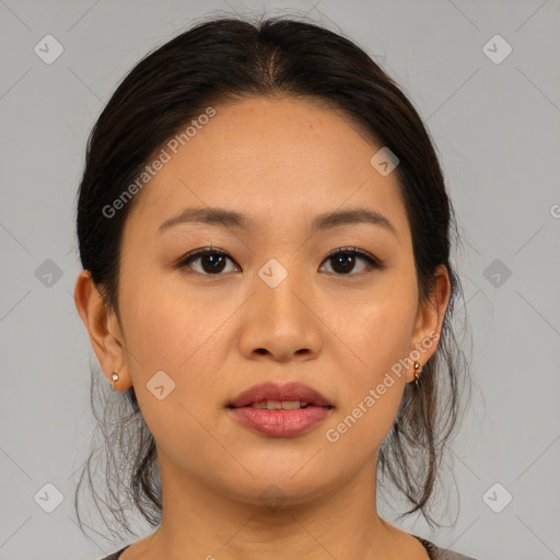 Joyful asian young-adult female with medium  brown hair and brown eyes