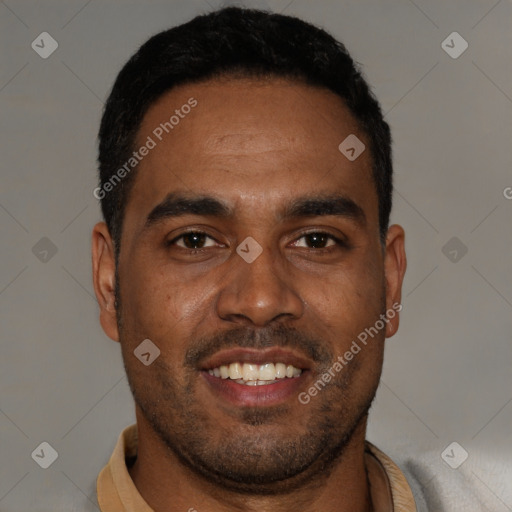 Joyful black young-adult male with short  black hair and brown eyes