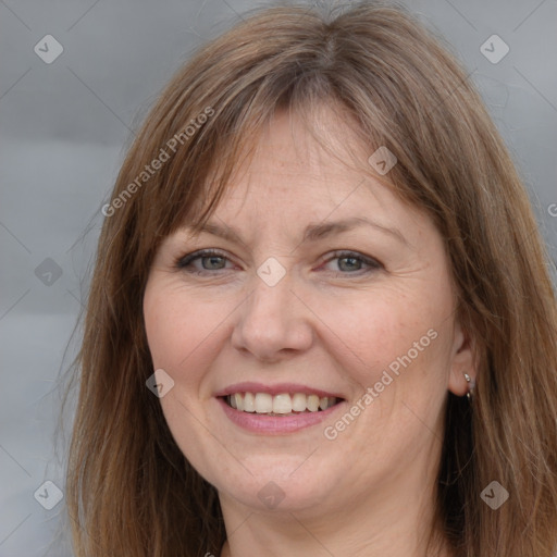 Joyful white adult female with medium  brown hair and grey eyes