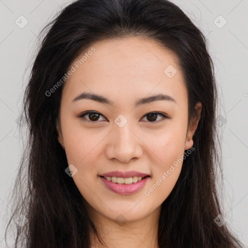 Joyful asian young-adult female with long  brown hair and brown eyes