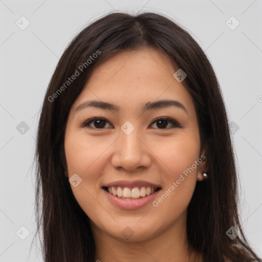 Joyful latino young-adult female with long  brown hair and brown eyes