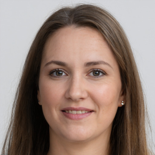 Joyful white young-adult female with long  brown hair and grey eyes