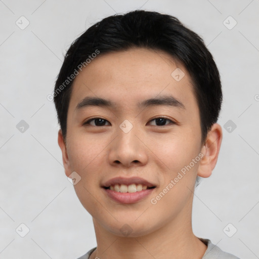 Joyful asian young-adult male with short  black hair and brown eyes