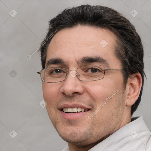 Joyful white adult male with short  brown hair and brown eyes