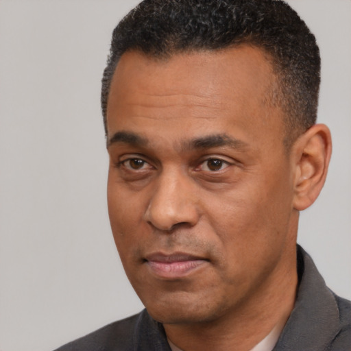 Neutral latino adult male with short  black hair and brown eyes