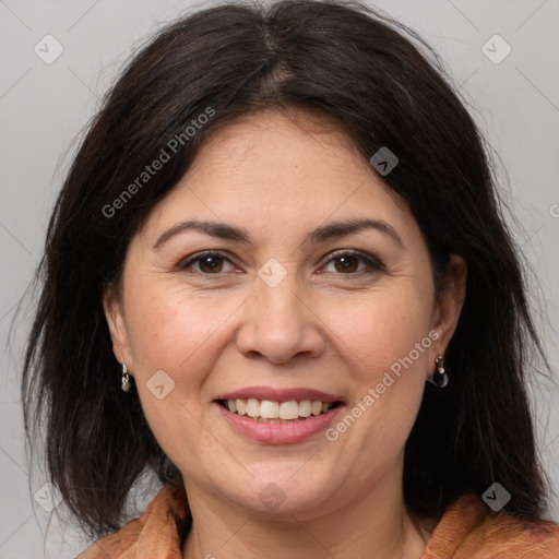 Joyful white adult female with medium  brown hair and brown eyes