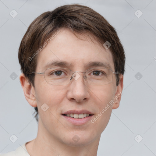 Joyful white adult male with short  brown hair and grey eyes