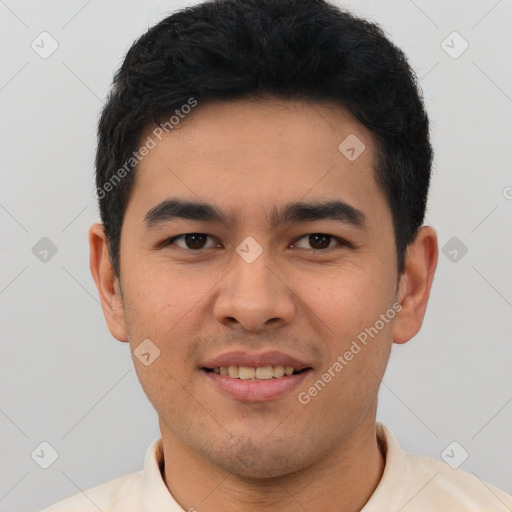 Joyful latino young-adult male with short  brown hair and brown eyes