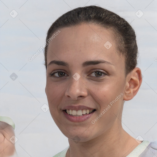 Joyful white young-adult female with short  brown hair and brown eyes