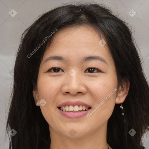 Joyful asian young-adult female with long  brown hair and brown eyes