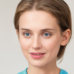 Joyful white young-adult female with medium  brown hair and blue eyes