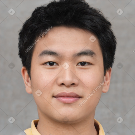 Joyful asian young-adult male with short  black hair and brown eyes