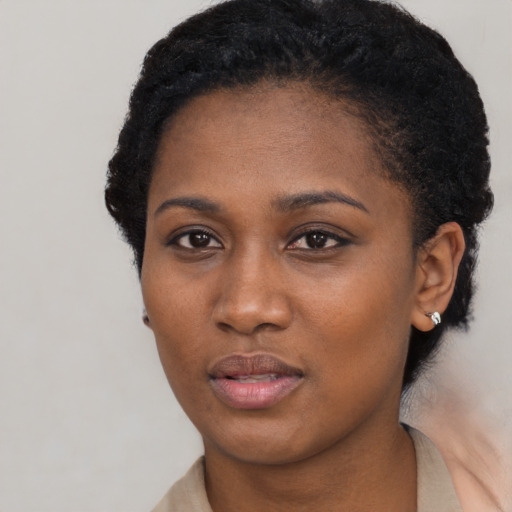 Neutral black young-adult female with short  black hair and brown eyes