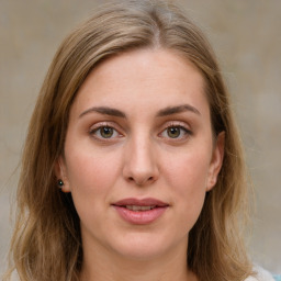 Joyful white young-adult female with medium  brown hair and green eyes