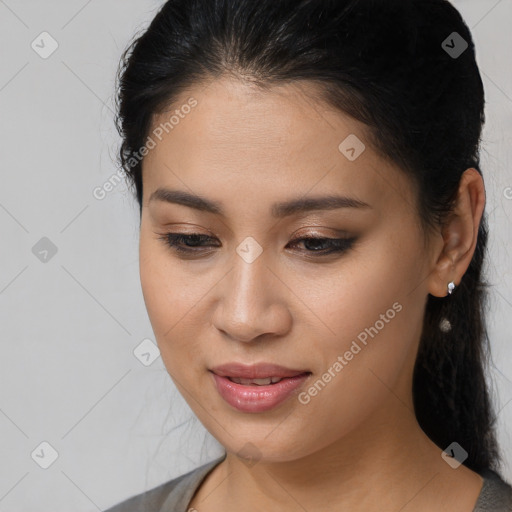 Joyful latino young-adult female with medium  brown hair and brown eyes