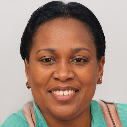 Joyful latino adult female with short  brown hair and brown eyes