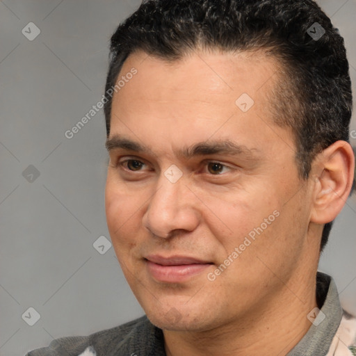 Joyful white adult male with short  black hair and brown eyes