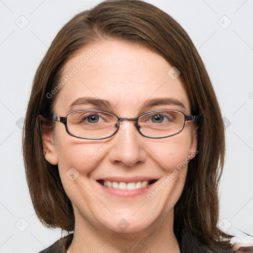 Joyful white adult female with medium  brown hair and grey eyes