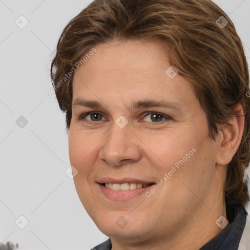 Joyful white adult female with medium  brown hair and brown eyes