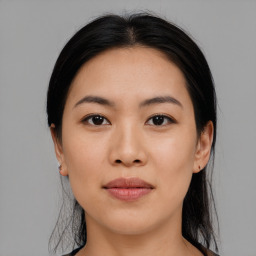 Joyful asian young-adult female with medium  black hair and brown eyes