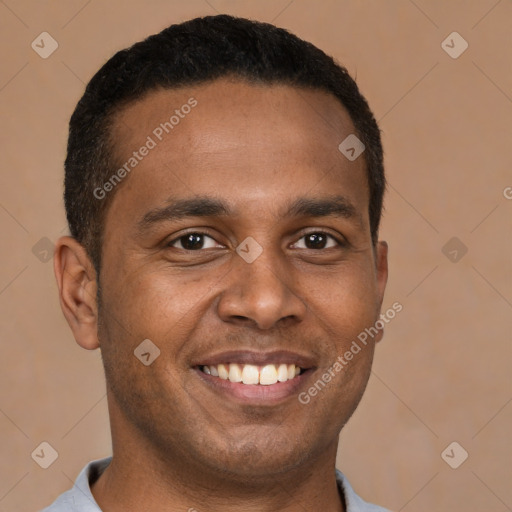 Joyful latino young-adult male with short  brown hair and brown eyes