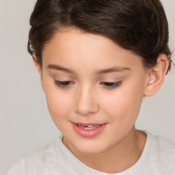 Joyful white child female with short  brown hair and brown eyes