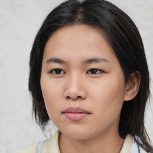 Neutral asian young-adult female with medium  brown hair and brown eyes