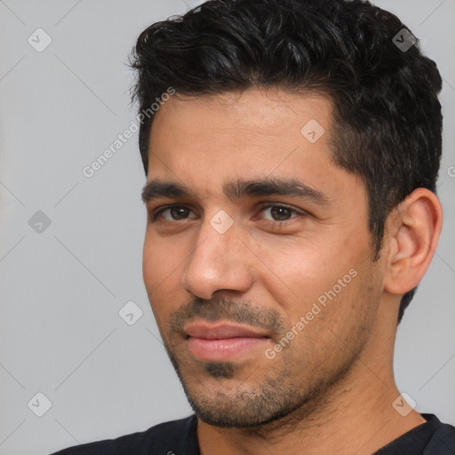 Joyful white young-adult male with short  black hair and brown eyes