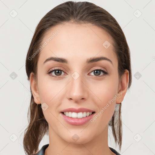 Joyful white young-adult female with medium  brown hair and grey eyes