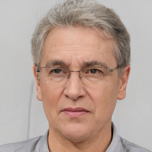 Neutral white middle-aged male with short  gray hair and brown eyes