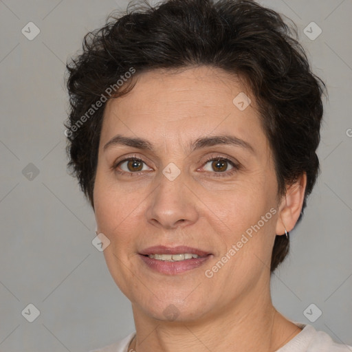 Joyful white adult female with short  brown hair and brown eyes