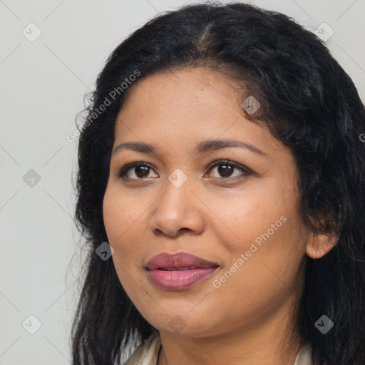 Joyful latino young-adult female with long  brown hair and brown eyes