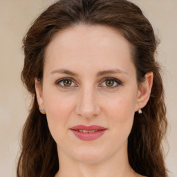 Joyful white young-adult female with long  brown hair and green eyes