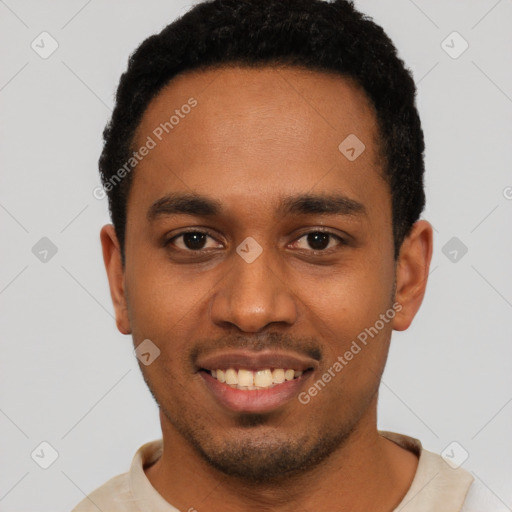 Joyful black young-adult male with short  black hair and brown eyes