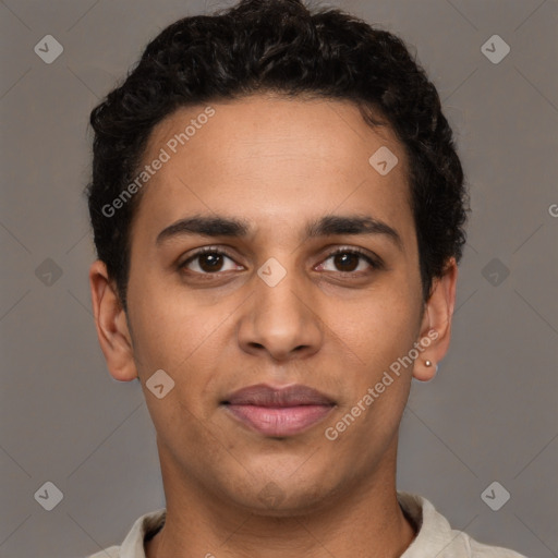 Joyful latino young-adult male with short  brown hair and brown eyes