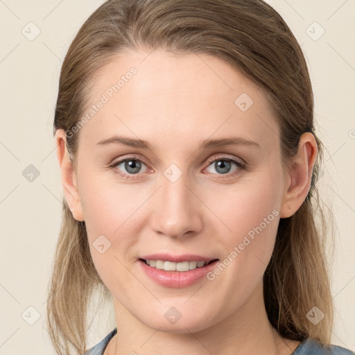 Joyful white young-adult female with medium  brown hair and blue eyes