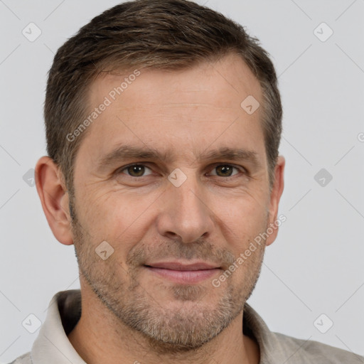 Joyful white adult male with short  brown hair and brown eyes