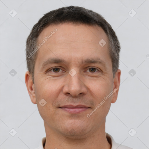 Joyful white adult male with short  brown hair and brown eyes