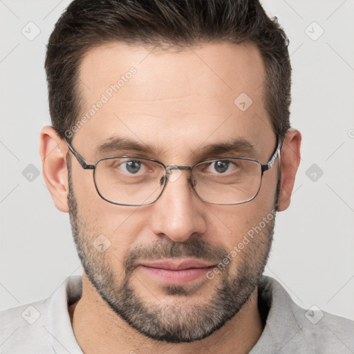 Joyful white adult male with short  brown hair and brown eyes