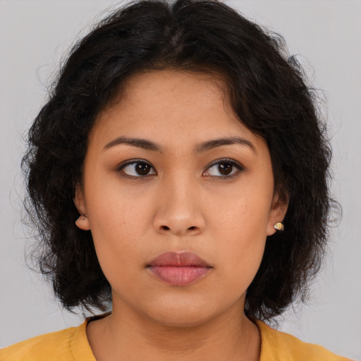 Neutral asian young-adult female with medium  brown hair and brown eyes