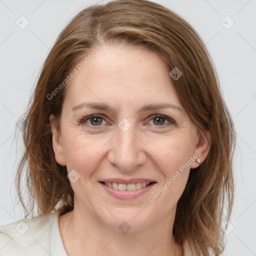 Joyful white adult female with medium  brown hair and grey eyes