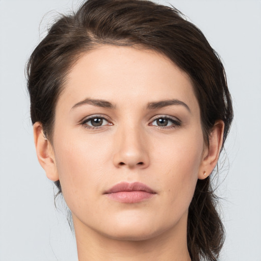 Neutral white young-adult female with medium  brown hair and brown eyes