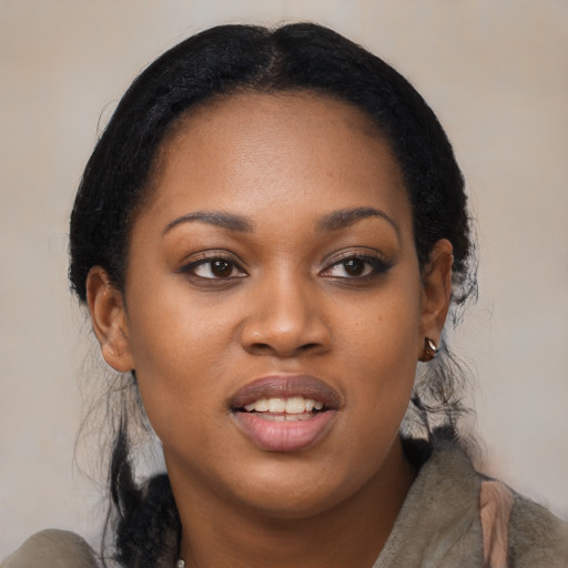 Joyful black young-adult female with medium  black hair and brown eyes