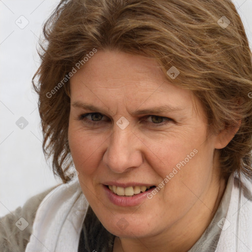 Joyful white adult female with long  brown hair and brown eyes