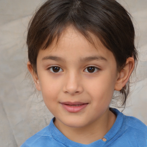 Joyful white child female with medium  brown hair and brown eyes