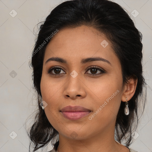 Joyful latino young-adult female with medium  brown hair and brown eyes