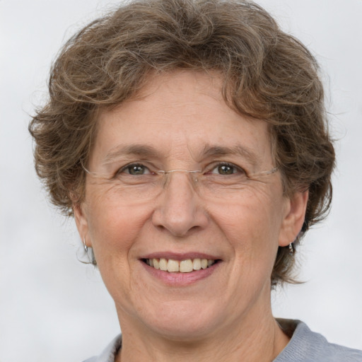 Joyful white middle-aged female with medium  brown hair and brown eyes