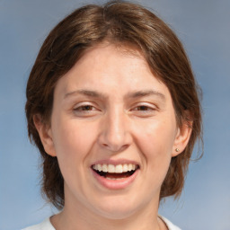 Joyful white adult female with medium  brown hair and brown eyes