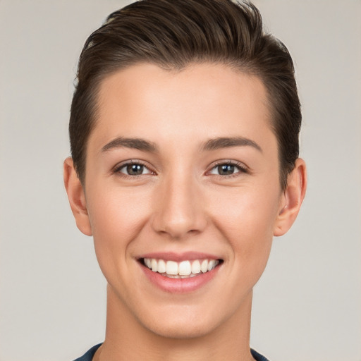 Joyful white young-adult female with short  brown hair and brown eyes